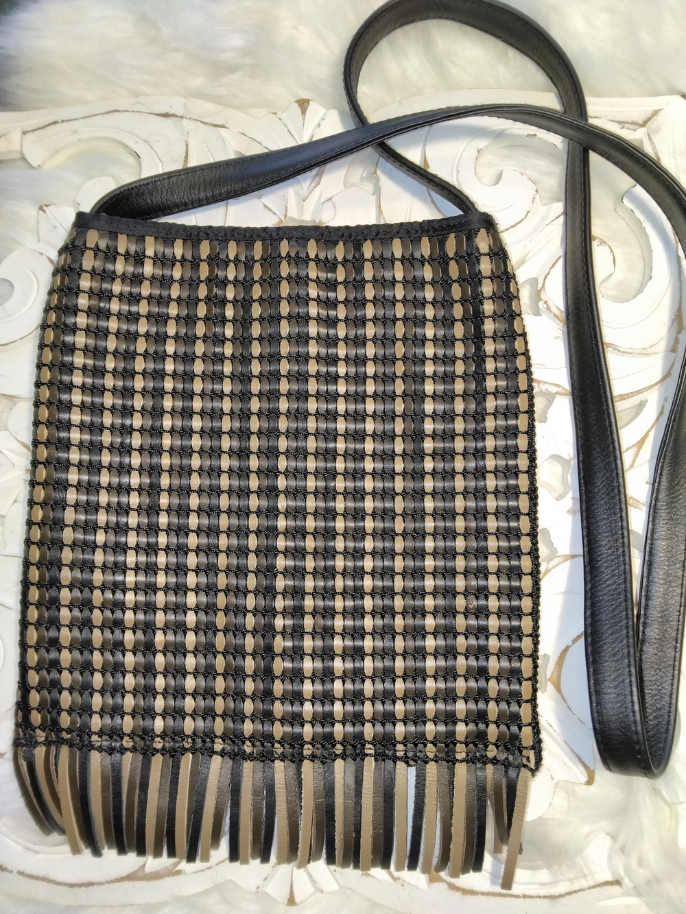 The Sak Black and Tan Woven Fringe Crossbody Bag